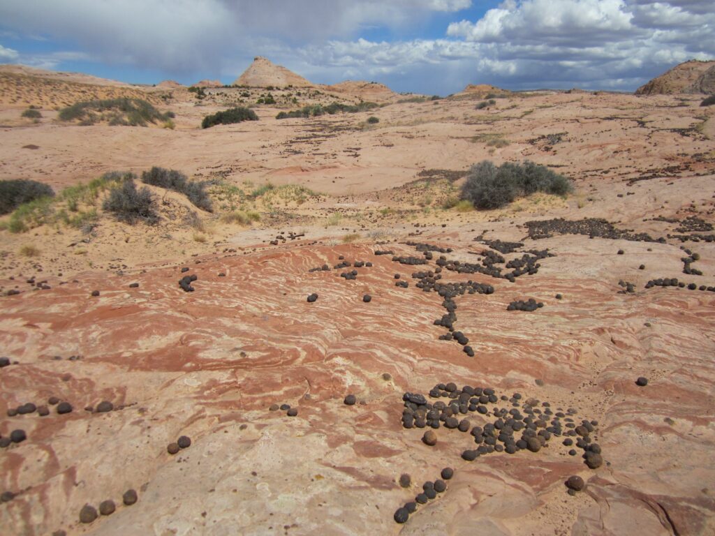The surveyed site selected for the art piece in the Grand Staircase-Escalante National Monument shows Moqui marbles scattered across rock formations, Kanab, Utah, Date unspecified | Photo courtesy of Marjorie Chan, St. George News